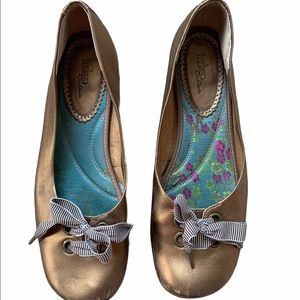 Clarks gold flats with striped ties